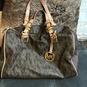 Michael Kors bag. Great condition. Brown and black logo print.